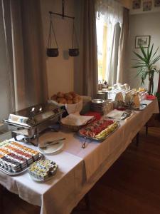 a table with many different types of food on it at Zum Grünen Jäger in Barsinghausen