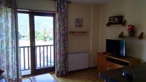 TV a/nebo společenská místnost v ubytování Apartamento Erta