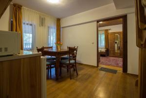 a kitchen and dining room with a table and chairs at к-г Луна к-с Лонгоза комплекс Лонгоза in Byala