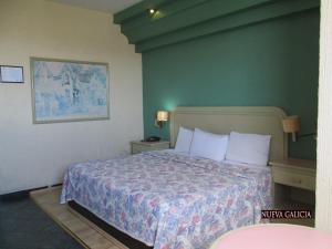 Cama o camas de una habitación en Hotel Nueva Galicia