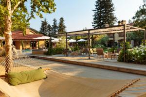 a hammock in the middle of a patio at Napa Valley Lodge in Yountville