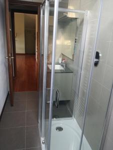 a shower with a glass door in a bathroom at Lari Baveno in Baveno