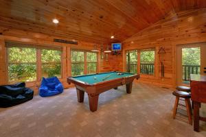 a billiard room with a pool table in a cabin at Natural Attractions in Gatlinburg