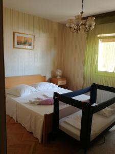 Posteľ alebo postele v izbe v ubytovaní apartman Kate