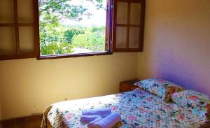 Łóżko lub łóżka w pokoju w obiekcie Pousada Portal do Peruaçu