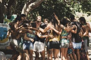 a group of young people hugging each other at Lagarto Na Banana Hostel in Pipa