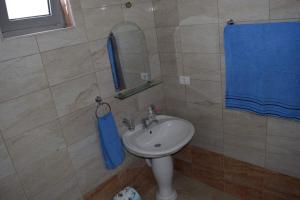 a bathroom with a sink and a mirror at Leli Apartments in Ulcinj +23 photos