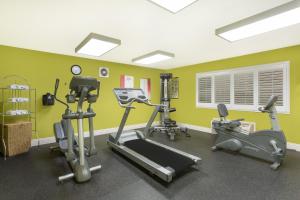 a gym with exercise equipment in a room at Baymont by Wyndham Modesto Salida in Modesto