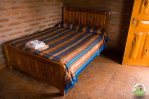Postel nebo postele na pokoji v ubytování Casa Hotel Loma Wasi en Cotacachi