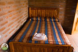 Postel nebo postele na pokoji v ubytování Casa Hotel Loma Wasi en Cotacachi