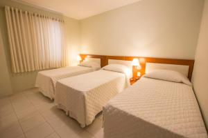 Postel nebo postele na pokoji v ubytování Hotel Ipanema de Sorocaba