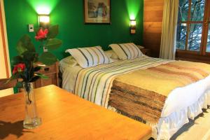 Postel nebo postele na pokoji v ubytování Hotel Malalhue
