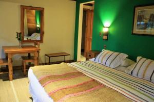 Postel nebo postele na pokoji v ubytování Hotel Malalhue