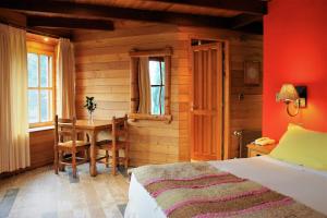 Postel nebo postele na pokoji v ubytování Hotel Malalhue