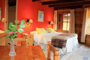 Postel nebo postele na pokoji v ubytování Hotel Malalhue