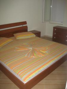 Postel nebo postele na pokoji v ubytování Guest House Vila Mimoza