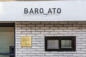 a sign on the side of a building with a window at Hotel Baroato 2nd in Seoul