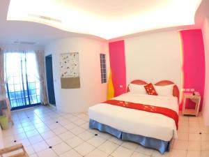 Uma cama ou camas num quarto em Yujian Kending Tese Homestay