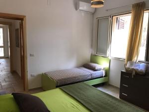 Ένα ή περισσότερα κρεβάτια σε δωμάτιο στο Casa Vacanza Elvira Porto Selvaggio