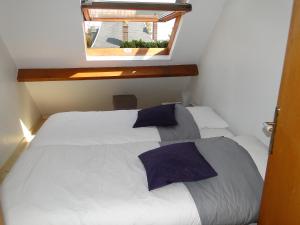 En eller flere senge i et værelse på Cote Port