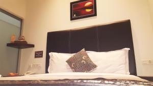 Postel nebo postele na pokoji v ubytování Sunrise Hotel Jombor Jogja