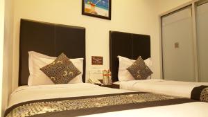 Postel nebo postele na pokoji v ubytování Sunrise Hotel Jombor Jogja + 32 fotografií