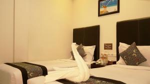 Postel nebo postele na pokoji v ubytování Sunrise Hotel Jombor Jogja