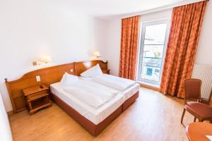 Postel nebo postele na pokoji v ubytování Familie Hopfeld - Hotel Dreikönigshof