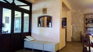 a room with a bench in front of a door at Agriturismo Casale Sera in Fontana Liri