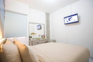 Letto o letti in una camera di De Green Inn @aeropolis