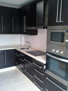 A kitchen or kitchenette at Villa Rosa Amparo
