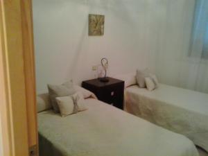 Postel nebo postele na pokoji v ubytování Villa Rosa Amparo