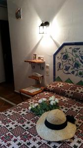 מיטה או מיטות בחדר ב-Hostal la Ninfa