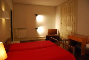 Cama ou camas em um quarto em HI Guimaraes - Pousada de Juventude