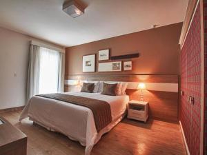 Cama ou camas em um quarto em Costa Verde Tabatinga Hotel