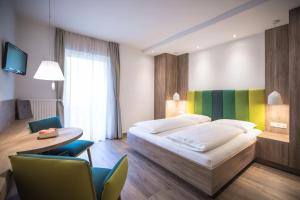 Voodi või voodid majutusasutuse Hotel Garni Andrianerhof toas