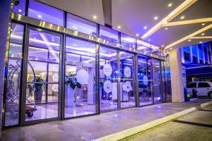a store front with a bunch of glass windows at Novotel Yanbu Albahr in Yanbu +71 photos