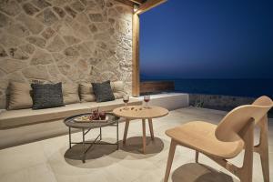 A seating area at Niova Villa - Seafront, private pool and Ionian Sea Views, by ZanteWize