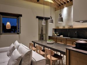 A kitchen or kitchenette at Niova Villa - Seafront, private pool and Ionian Sea Views, by ZanteWize