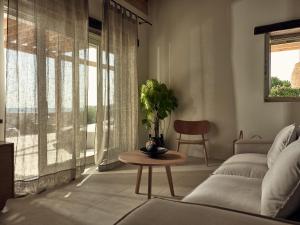 A seating area at Niova Villa - Seafront, private pool and Ionian Sea Views, by ZanteWize