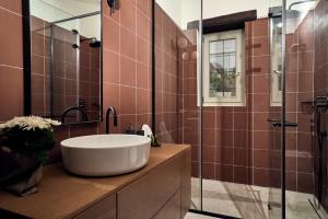 A bathroom at Niova Villa - Seafront, private pool and Ionian Sea Views, by ZanteWize
