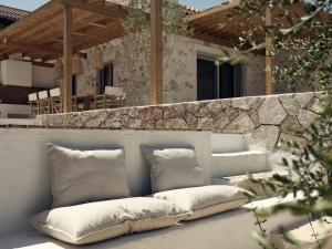 A seating area at Niova Villa - Seafront, private pool and Ionian Sea Views, by ZanteWize