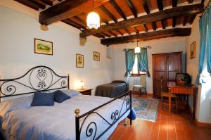 a bedroom with a large bed and a desk at La Casa Colonica wine and oil in Tuoro sul Trasimeno +134 photos