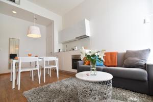 a living room with a couch and a table at The Bridge Luxury Apartments in Zadar