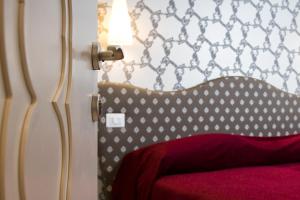 Posteľ alebo postele v izbe v ubytovaní Hotel Ca' Nobile Corner