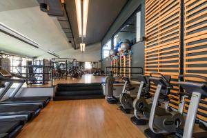 a gym with treadmills and cardio equipment in a room at Hotel San Marco in Montebelluna