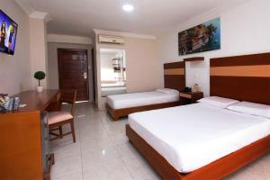 Voodi või voodid majutusasutuse Hotel Genova Centro toas