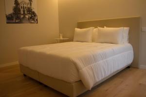 Postel nebo postele na pokoji v ubytování Feira Hostel & Suites