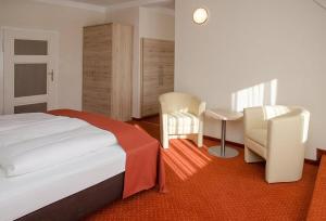Säng eller sängar i ett rum på Gasthaus-Pension Schwarzer Graf