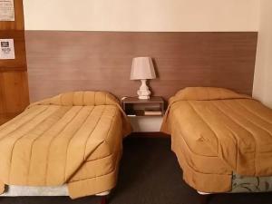 Cama o camas de una habitación en Hostal Chordeleg